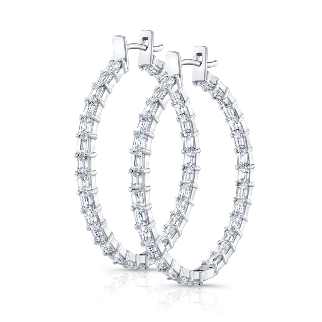 1.25"" Oval shaped inside out hoop earrings in 18K WG with prong set (48) emerald cut diamonds.  D5.04ct.t.w.