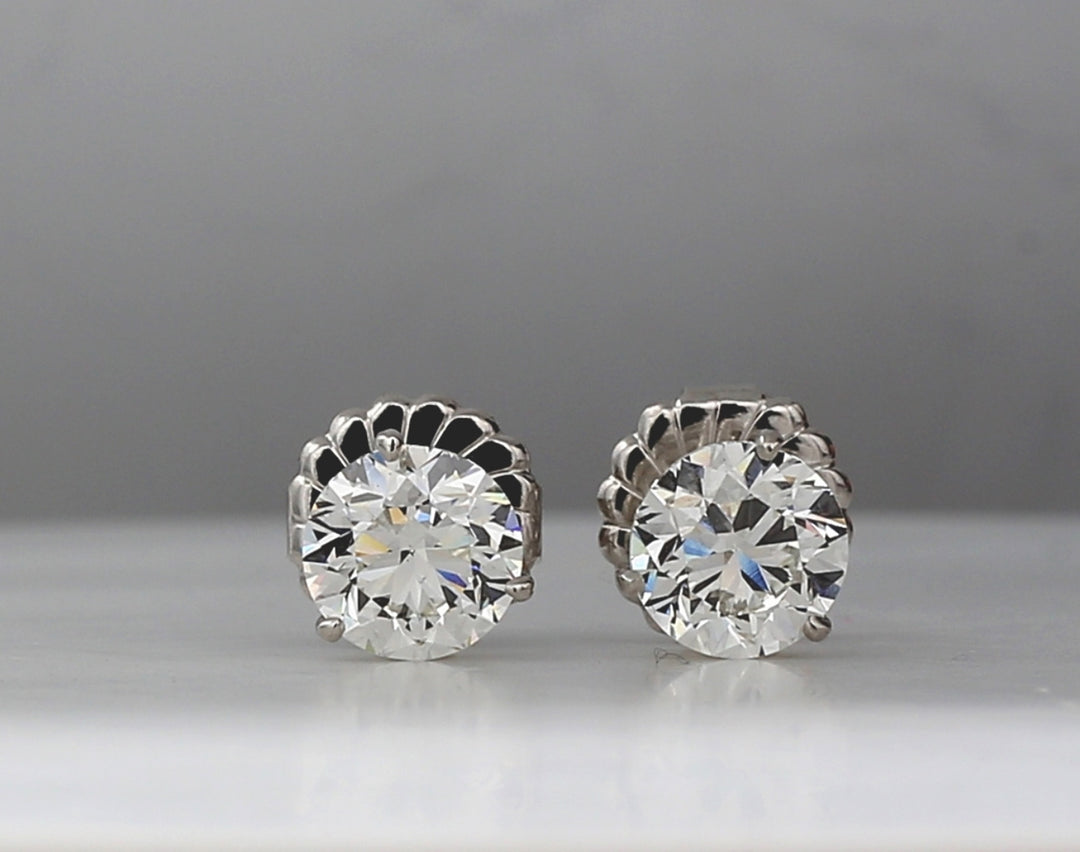 Push back martini style stud earrings with 3-prong set GIA certified H/VS2 round diamonds.  D4.00ct.t.w.