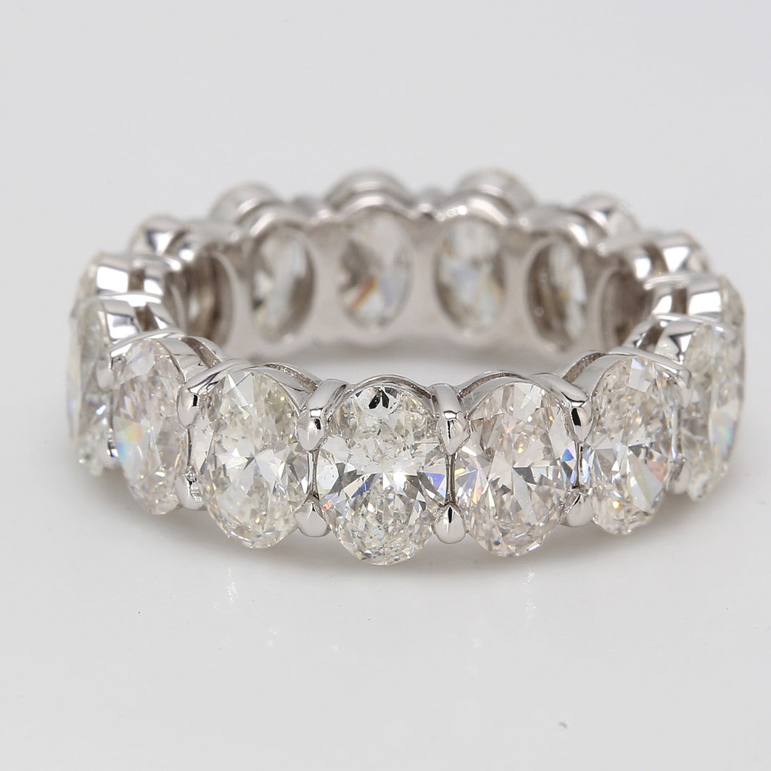 Eternity band in platinum with shared basket claw prong set GIA certified G-H/VS1-SI1 (15) oval diamonds.  D7.67ct.t.w.  Size 5.75
