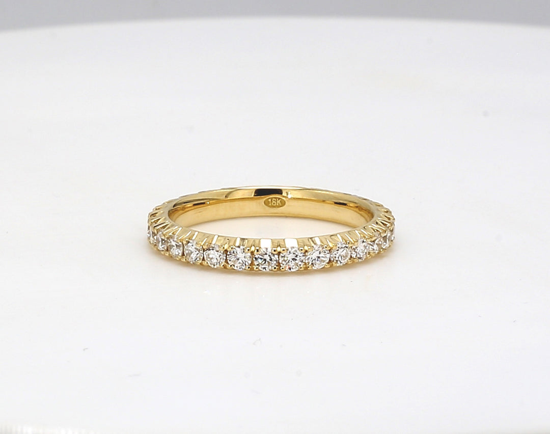 Eternity band in 18K YG with 4-prong basket set round diamonds.  D1.11ct.t.w.  Size 7
