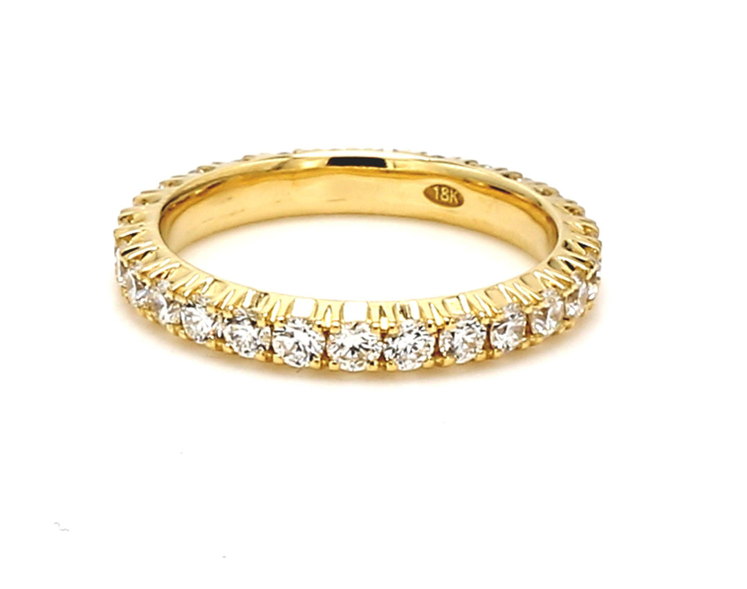 Eternity band in 18K YG with prong set (27) round diamonds.  D1.03ct.t.w.  Size 5