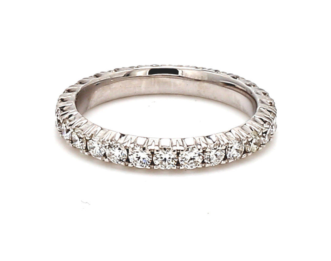 Eternity band in 18K WG with prong set (27) round diamonds.  D1.03ct.t.w.  Size 5