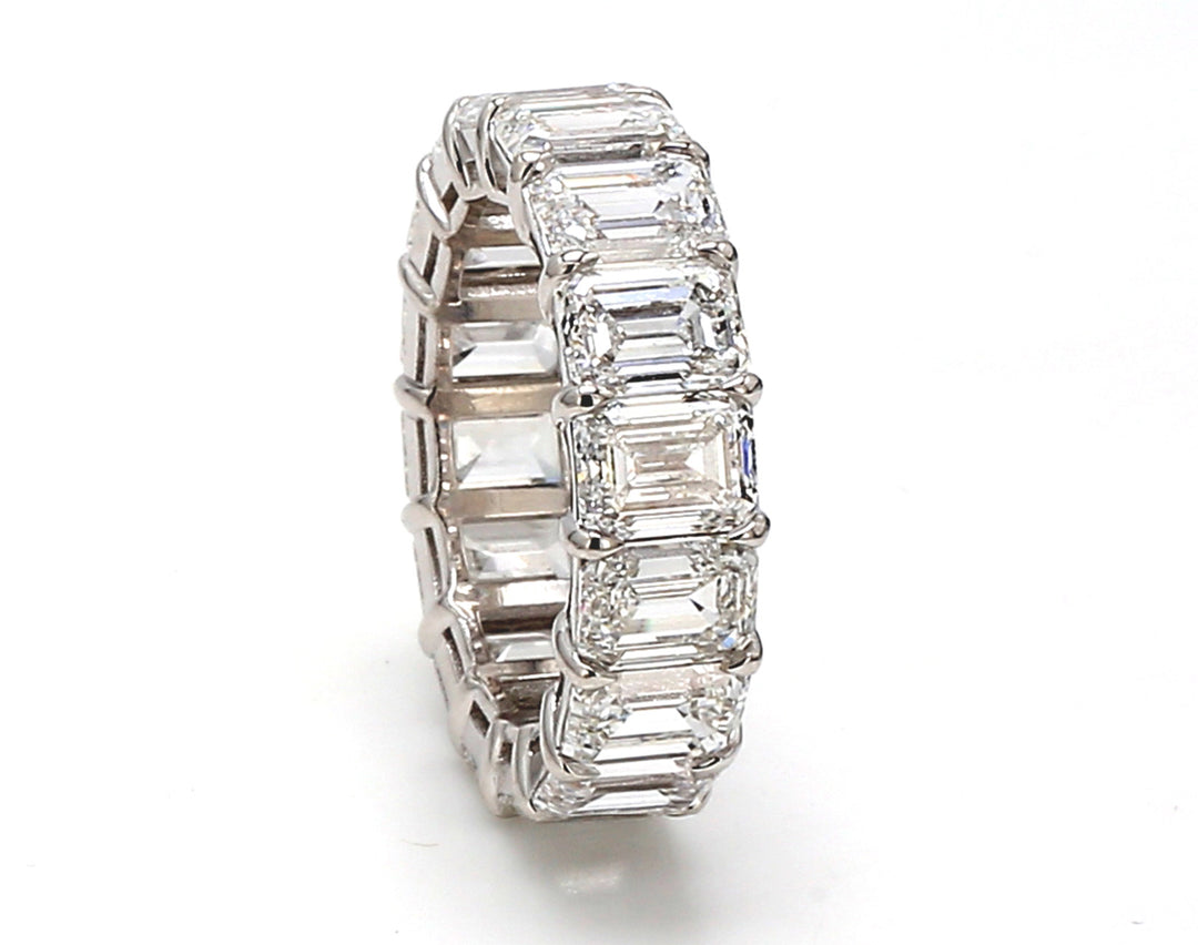 Eternity band in platinum with basket prong set GIA certified D-F/IF-VS1 (16) emerald cut diamonds.  D12.07ct.t.w.  Size 6.75