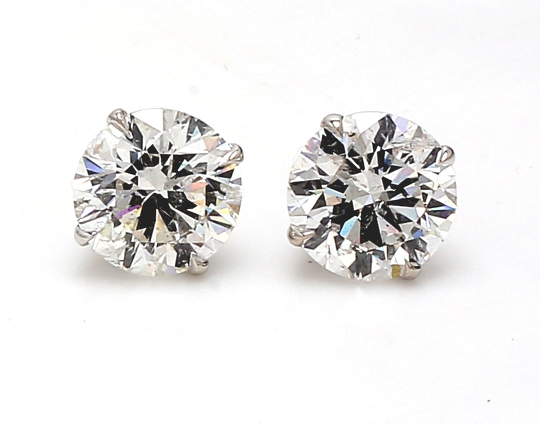 Screw back stud earrings with basket prong set USA certified F-G/SI2 round diamonds.  D7.40ct.t.w.