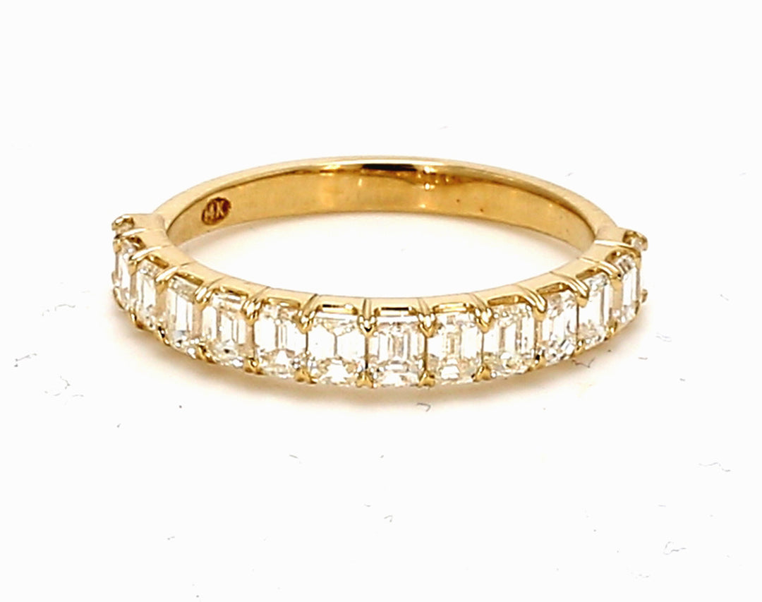 Single row band in yellow gold with prong set (14) emerald cut diamonds.  D1.23ct.t.w.  Size 6