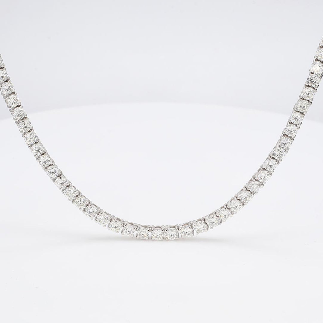 16"" Straight tennis necklace in 18K WG with basket prong set (93) round diamonds.  D28.02ct.t.w.