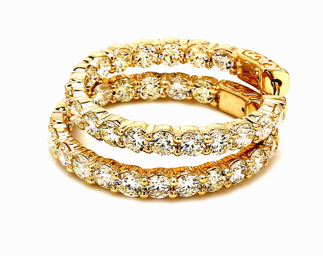 1.25"" Inside out hoop earrings in yellow gold with shared prong set (36) round diamonds.  D6.91ct.t.w.
