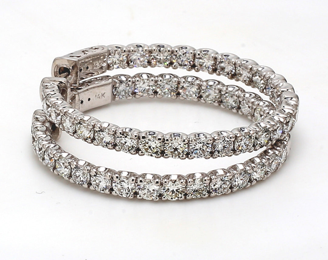 1.5"" Inside out hoop earrings with U-prong set (52) round diamonds.  D5.53ct.t.w.