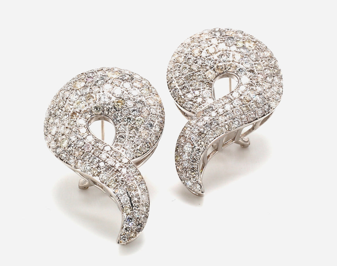 French clip back nautilus design earrings in 18K WG with pave set round diamonds.  D7.10ct.t.w.