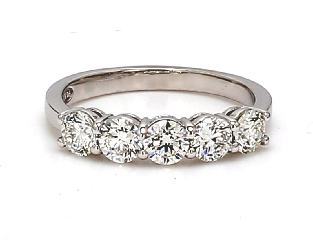 5-stone band in platinum with basket prong set round diamonds.  D0.96ct.t.w.  Size 5