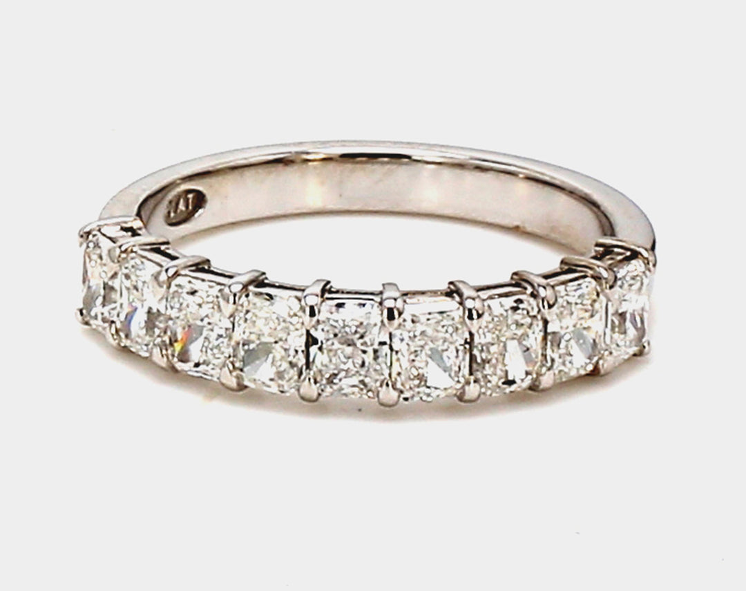 9-stone band in platinum with basket prong set radiant cut diamonds.  D1.31ct.t.w.  Size 5.75