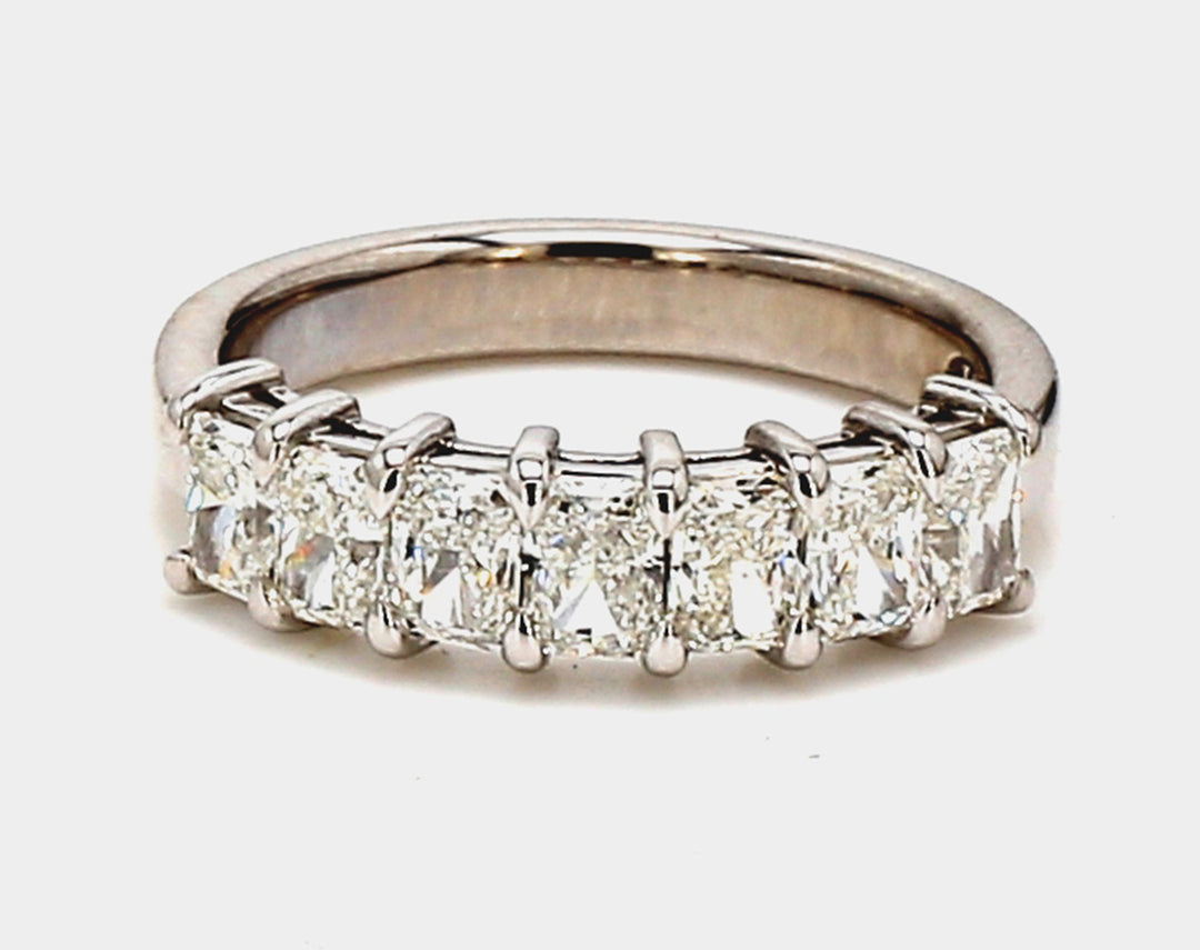 7-stone band in platinum with basket prong set radiant cut diamonds.  D1.42ct.t.w.  Size 6