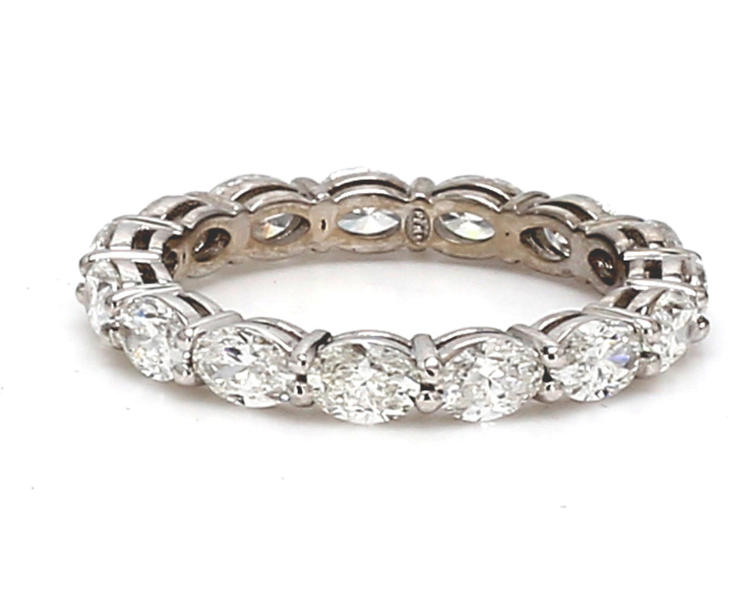 Eternity band east to west style in platinum with basket prong set (15) oval cut diamonds.  D2.04ct.t.w.  Size 5.75
