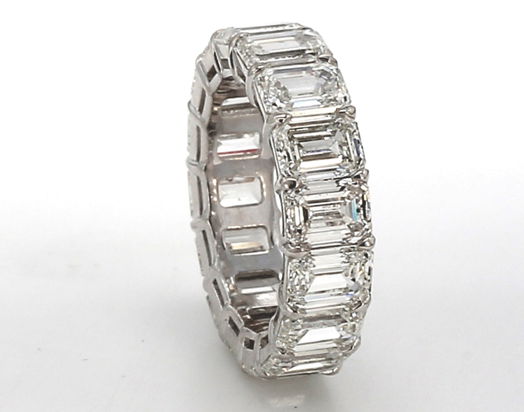 Eternity band in platinum with basket prong set GIA certified G-I/VVS-VS (16) emerald cut diamonds.  D8.12ct.t.w.  Size 4.75