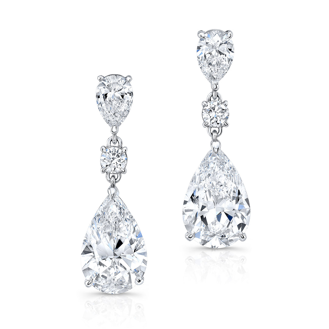 Push back dangling earrings with GIA certified G-H/SI2 pear shapes and basket prong set round diamonds.  D5.15ct.t.w.