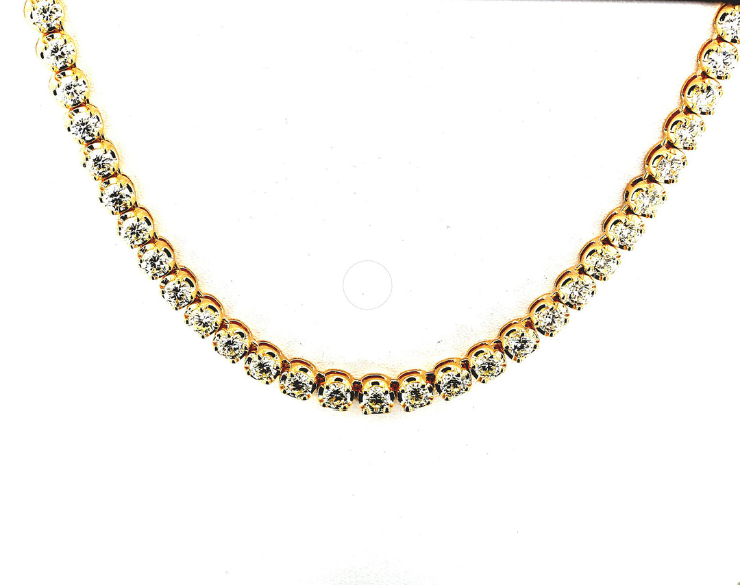 20"" Tennis necklace in 18K YG with crown prong set (102) round diamonds.  D19.20ct.t.w.