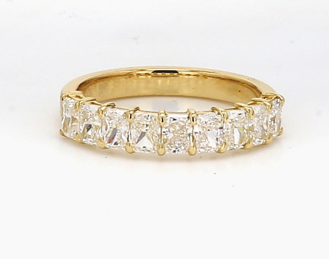9-stone band in 18K YG with basket prong set radiant cut diamonds.  D1.31ct.t.w.  Size 5.5