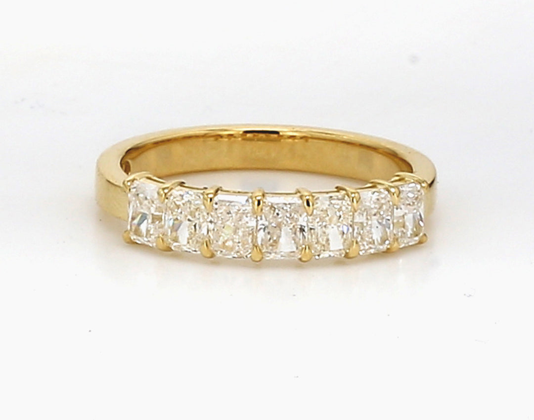 7-stone band in 18K YG with basket prong set radiant cut diamonds.  D1.03ct.t.w.  Size 5.5
