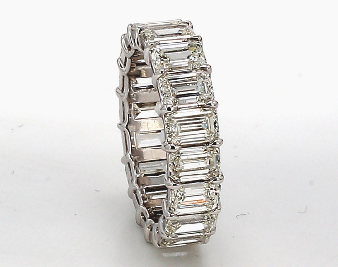 Eternity band in platinum with basket claw prong set G-H/VS+ (18) emerald cut diamonds.  D7.34ct.t.w.  Size 6.75