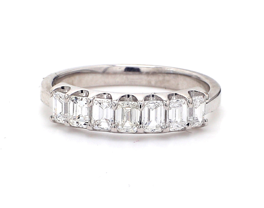 7-stone band in platinum with shared prong set emerald cut diamonds.  D0.87ct.t.w.  Size 5.75