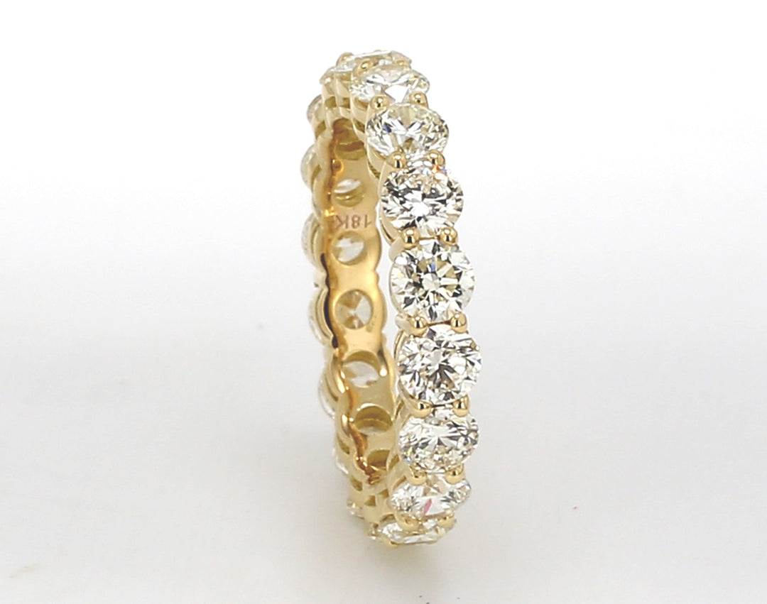 Eternity band in 18K YG with basket prong set (18) round diamonds.  D3.75ct.t.w.  Size 6.75