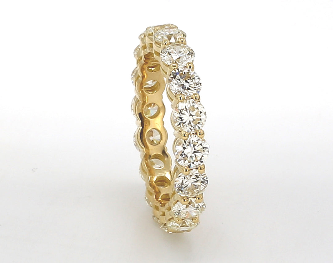 Eternity band in 18K YG with basket prong set (18) round diamonds.  D4.12ct.t.w.  Size 7.25