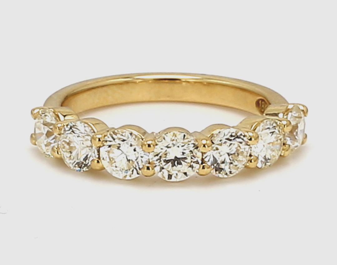 7-stone band in 18K YG with prong set round diamonds.  D1.65ct.t.w.  Size 5.5