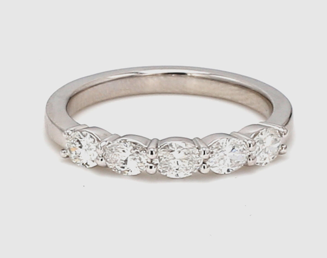 5-stone band east to west style in platinum with prong set oval cut diamonds.  D0.69ct.t.w.  Size 5.75
