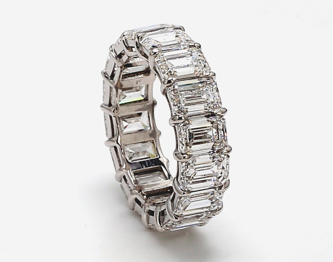 Eternity band in platinum w/ basket claw prong set GIA certified D-F/VVS2-VS2 (16) emerald cut diamonds.  D8.86ct.t.w.  Size 5.75