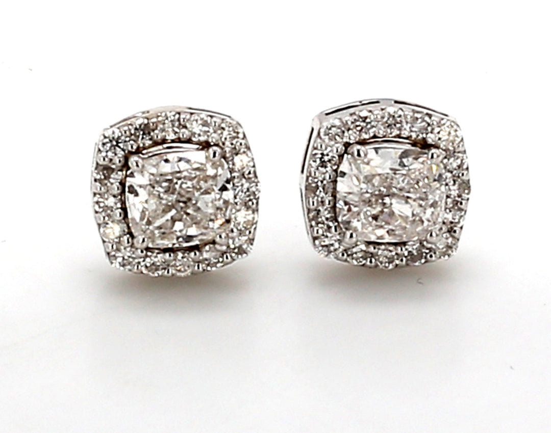 Push back halo stud earrings with prong set rounds around GIA certified E/SI1 cushion cut diamond center.  D1.53ct.t.w.  (Center - 1.20ct.)