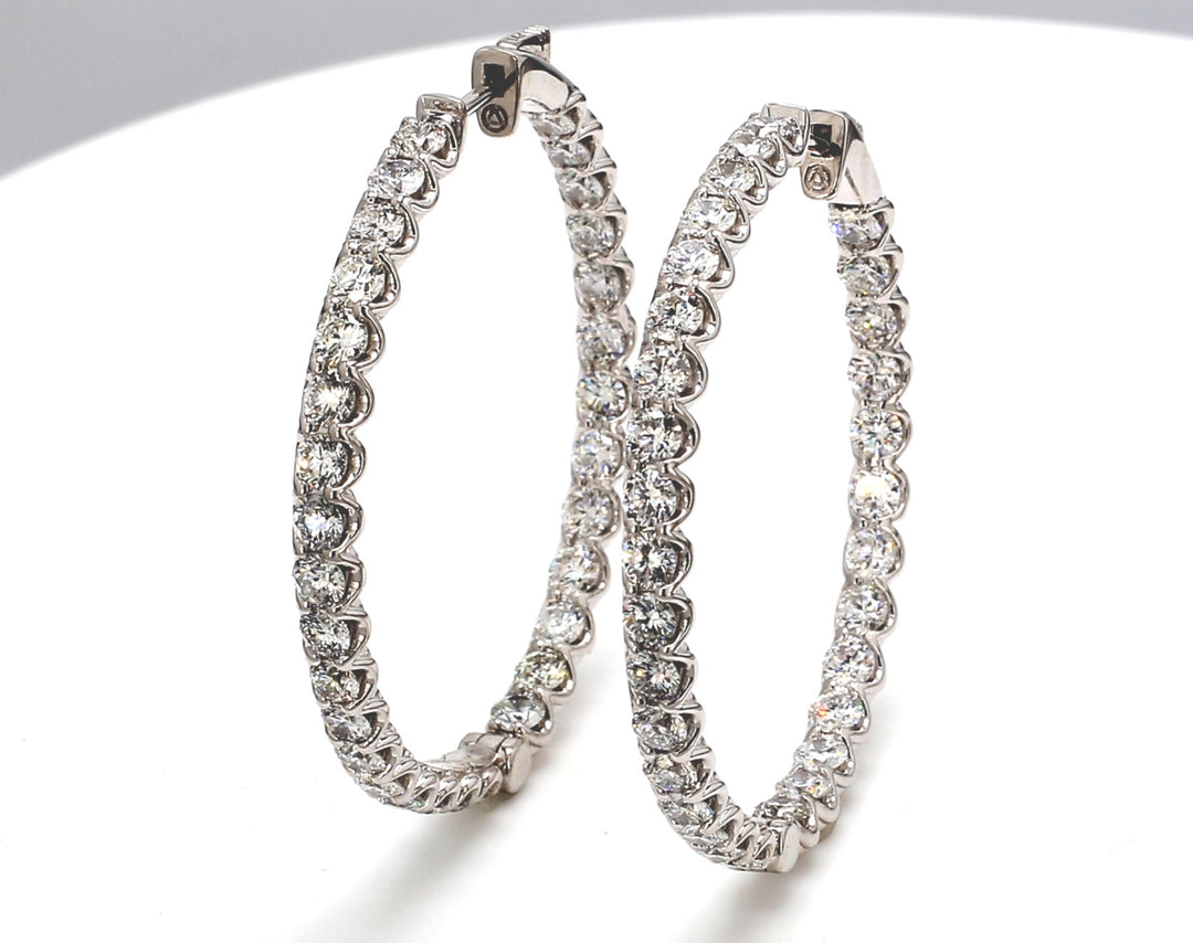 1.50"" Inside out hoop earrings with U-prong set (62) round diamonds.  D6.51ct.t.w.