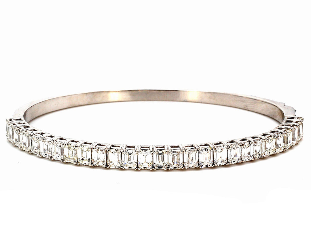 Half way bangle with basket prong  set (27) emerald cut diamonds.  D6.26ct.t.w.