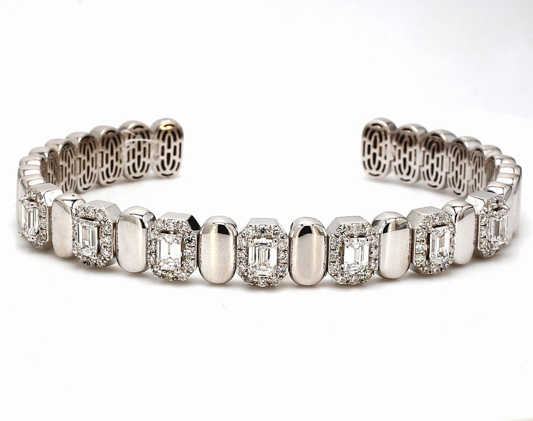 Halo open cuff bangle with alternation gold and 4-prong set (7) emerald cut diamonds.  D2.71ct. t.w.