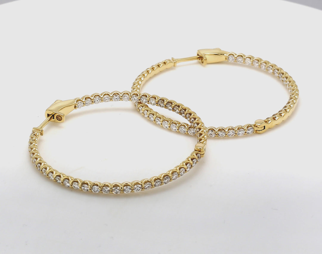 1.50"" Inside out hoop earrings in 18K YG with U-prong set (90) round diamonds.  D2.79ct.t.w.