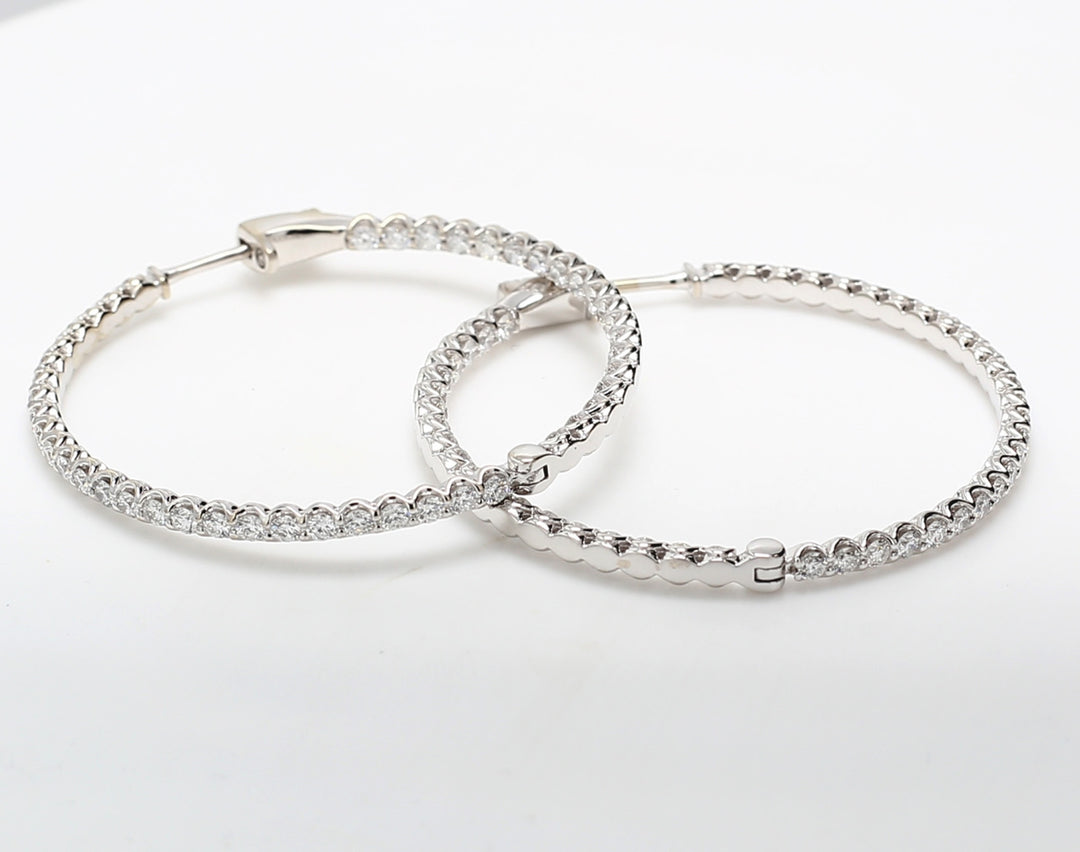 1.50"" Inside out hoop earrings with U-prong set (90) round diamonds.  D2.77ct.t.w.