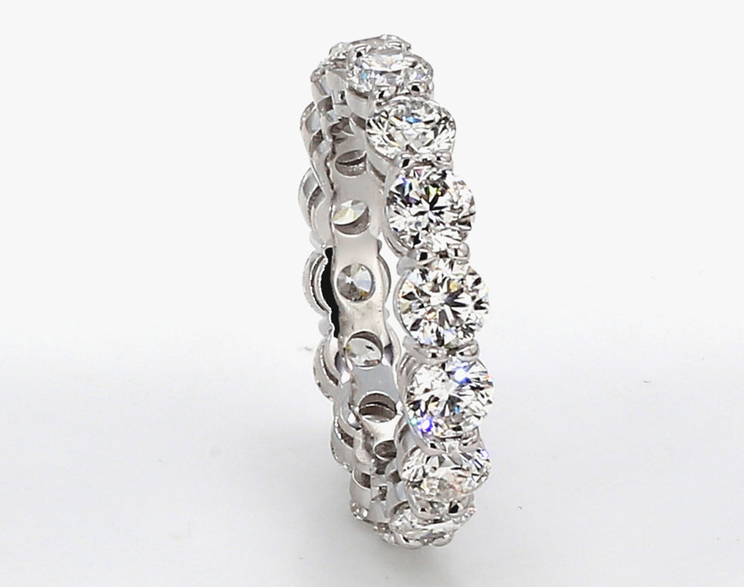 Eternity band in platinum w/ basket prong set (16) round diamonds.  D4.80ct.t.w.  Size 6.75