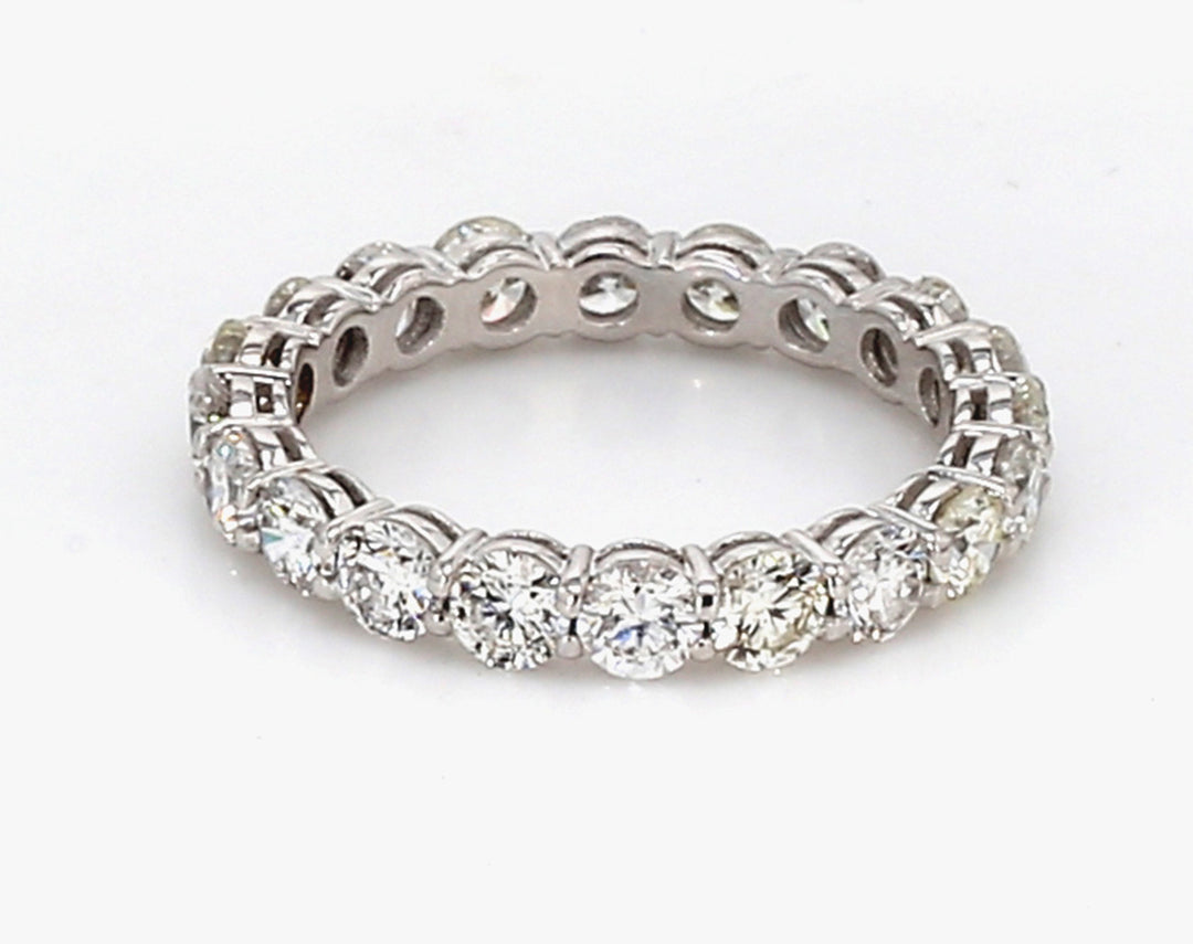 Eternity band in 18K WG w/ basket prong set (20) round diamonds.  D1.84ct.t.w.  Size 4.75