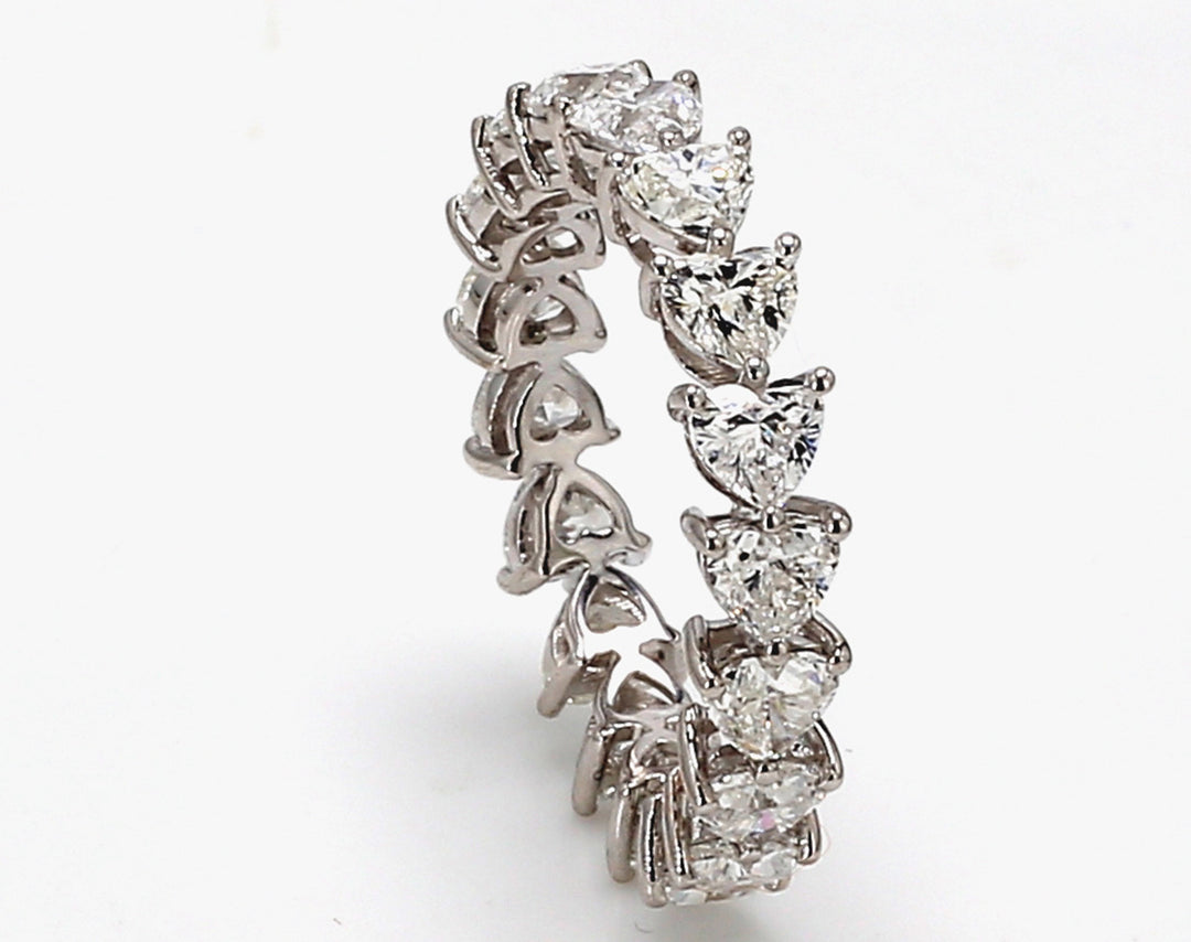 Eternity band east to west style in 18K WG w/ (18) heart shape diamonds.  D3.55ct.t.w.  Size 6.75