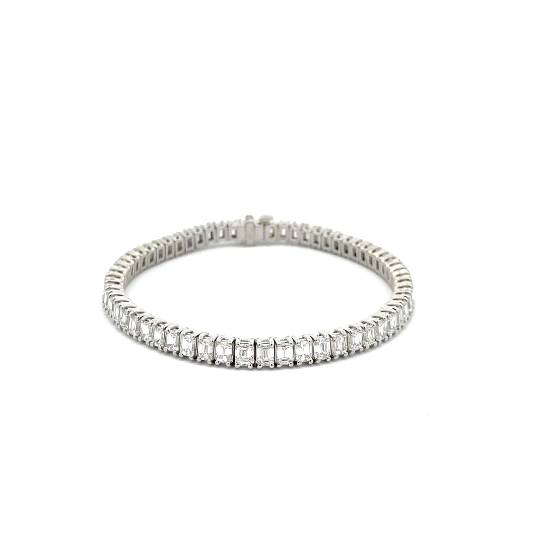 7"" Tennis bracelet in platinum with basket prong set (60) emerald cut diamonds.  D11.05ct.t.w.