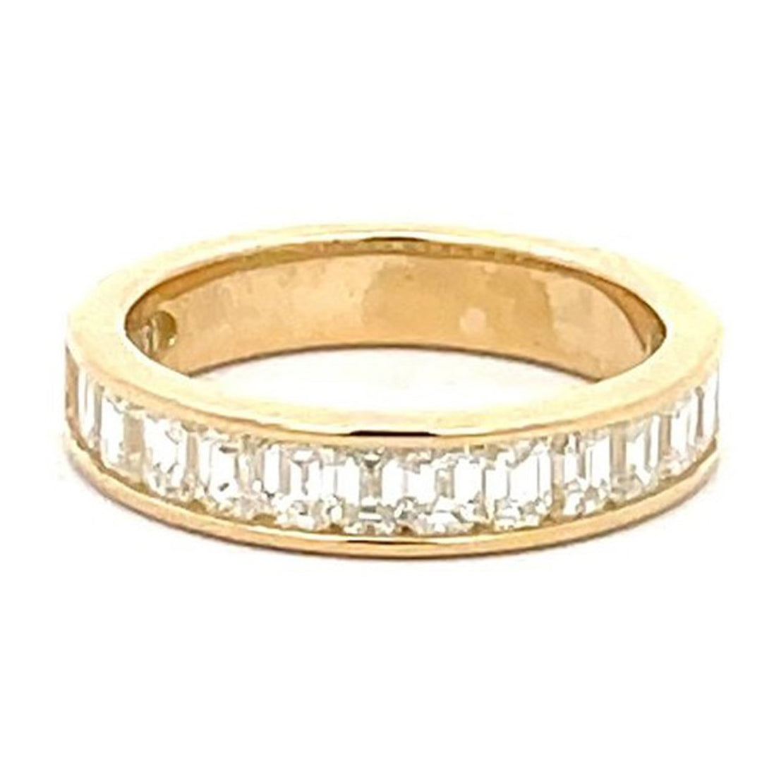 Single row band in 18K YG with channel set (15) emerald cut diamonds.  D1.23ct.t.w.  Size 5
