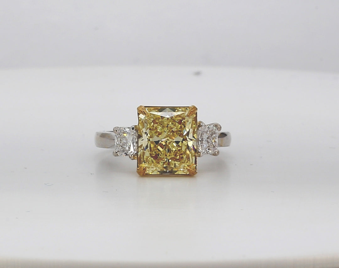 3-stone ring in platinum with basket set prong set radiants & basket set GIA certified FIY/SI1 radiant diamond center.  D4.71ct.t.w.  (Center - 4.02ct.)