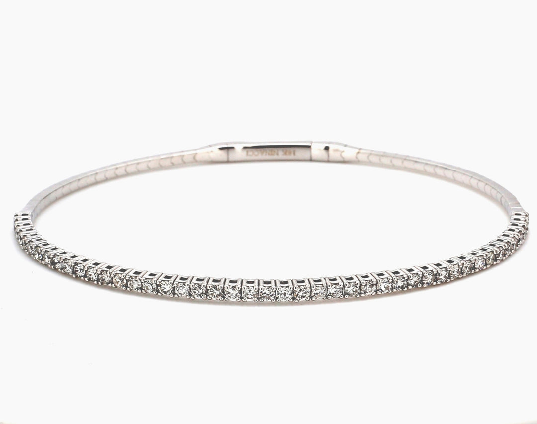 Flexible bangle in 18K WG with pre-set round diamond.  D1.01ct.t.w.