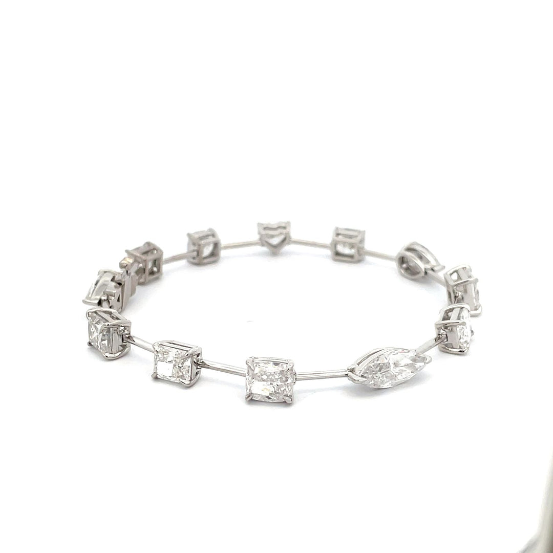 7"" Fancy bar bracelet in platinum with basket prong set multi-shape (12) diamonds.  D13.33ct.t.w.