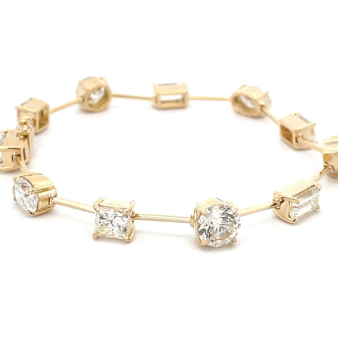 7"" Fancy bracelet in 18K YG with basket prong set (11) multishape diamonds.  D11.14ct.t.w.
