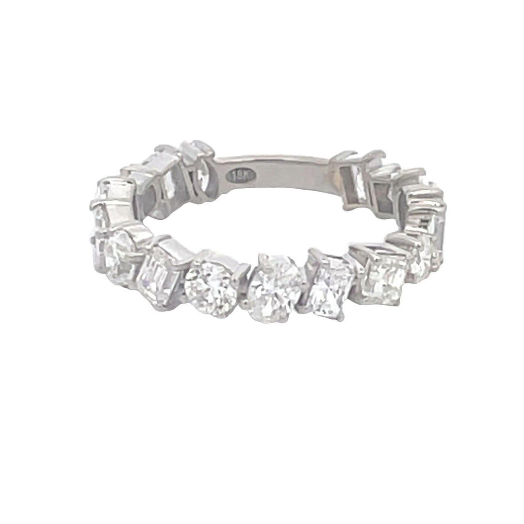 Band in 18K WG with prong set (16) multi-shape diamonds.    D2.29ct.t.w.  Size 6.25