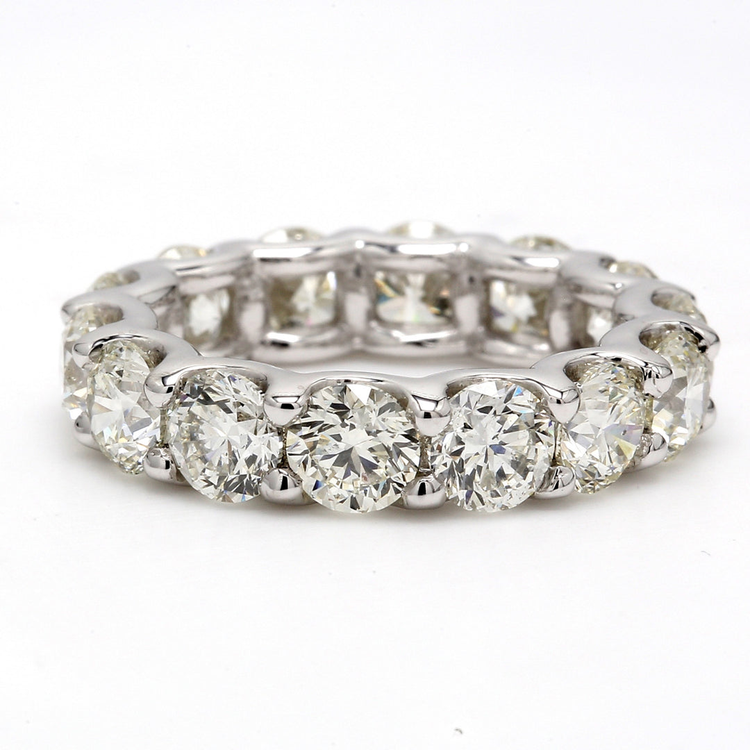 Eternity band in platinum with shared U-prong set (15) round cut diamonds.  D4.58ct.t.w.  Size 6