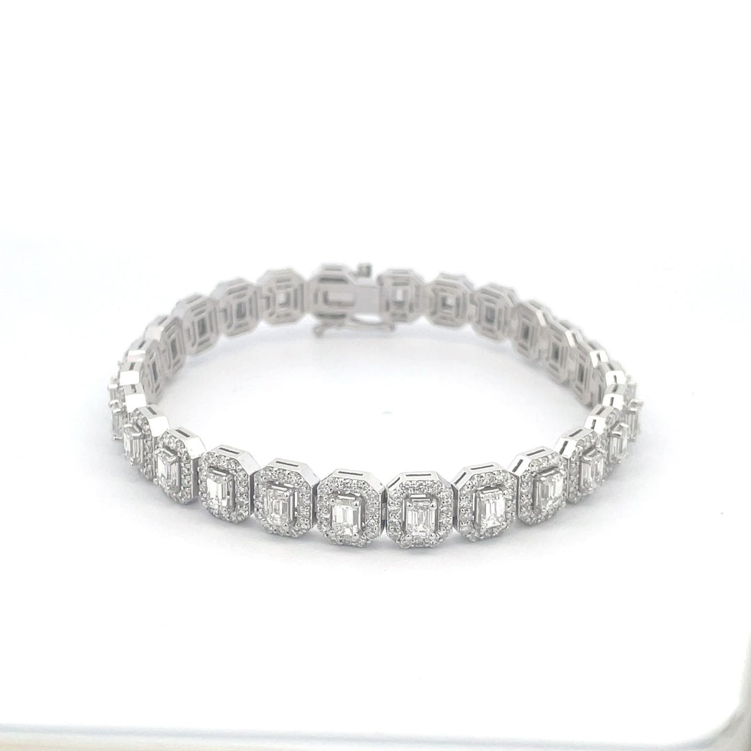 7"" Halo tennis bracelet with rounds around (26) emerald cut diamond centerstones.  D8.42ct.t.w.