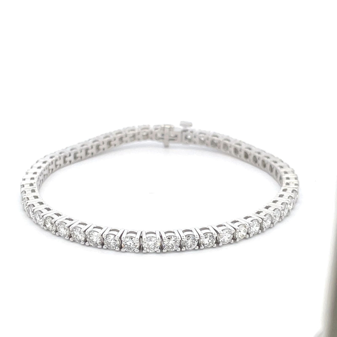 7"" Tennis bracelet with 4-prong basket  set (55) round diamonds.  D4.96ct.t.w.