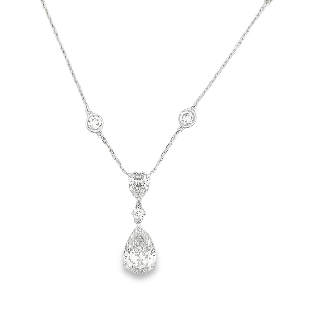 Diamonds by the yard style necklace in 18K WG with drop dangling pear shape.  D6.47ct.t.w.  (Center - 3.02ct.)