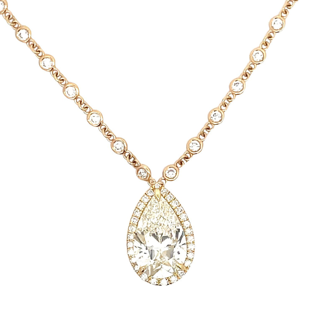 17.5"" Diamonds by the yard necklace in 18K YG with bezel and pave set rounds and a drop GIA certified K/SI2 pear shape diamond center.  D8.78ct.t.w.  (Center - 6.01ct.)